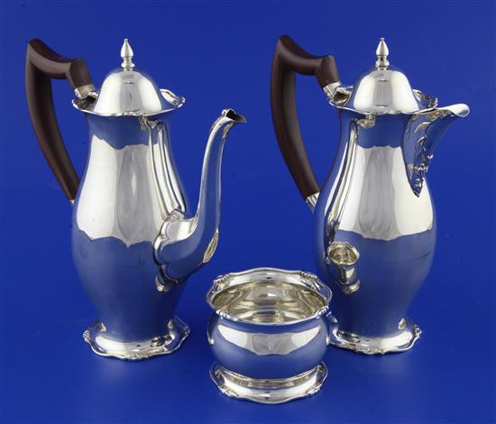 A 1930s silver cafe au lait pair and matching sugar bowl, gross 18 oz.